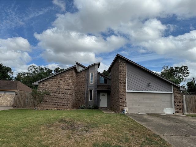 view of front facade with a front yard and a garage