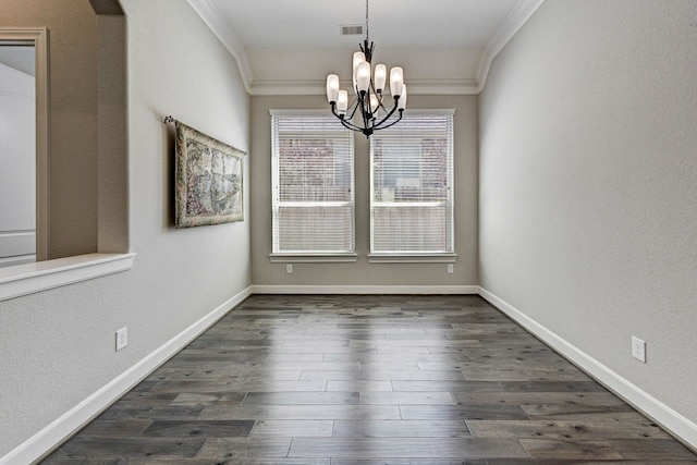 unfurnished dining area with dark hardwood / wood-style flooring, an inviting chandelier, and crown molding