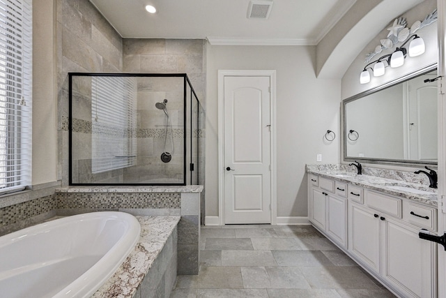 bathroom featuring vanity, separate shower and tub, crown molding, and a wealth of natural light