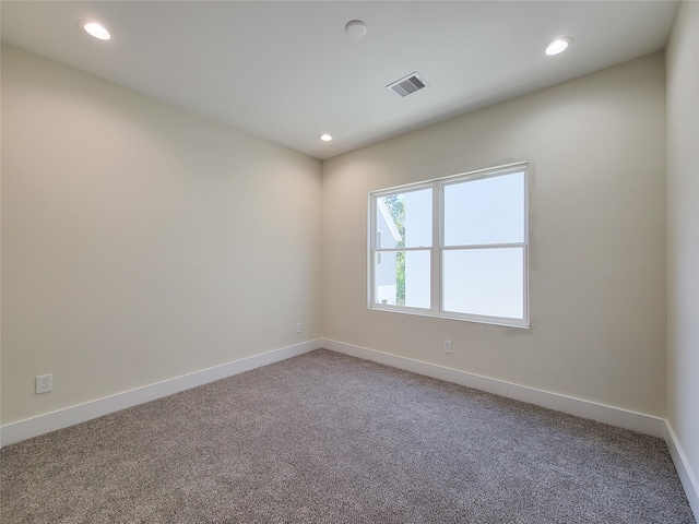 unfurnished room featuring carpet flooring