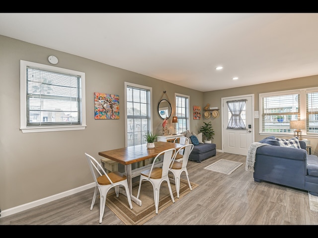 dining space with light wood-type flooring