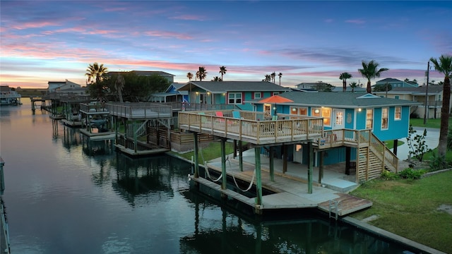 view of dock featuring a deck with water view