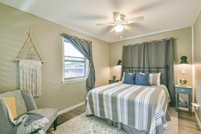 bedroom featuring ceiling fan and light hardwood / wood-style flooring