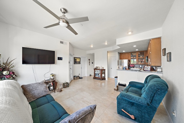 living room featuring ceiling fan