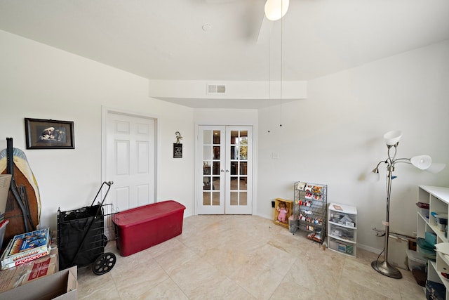 misc room featuring french doors and ceiling fan