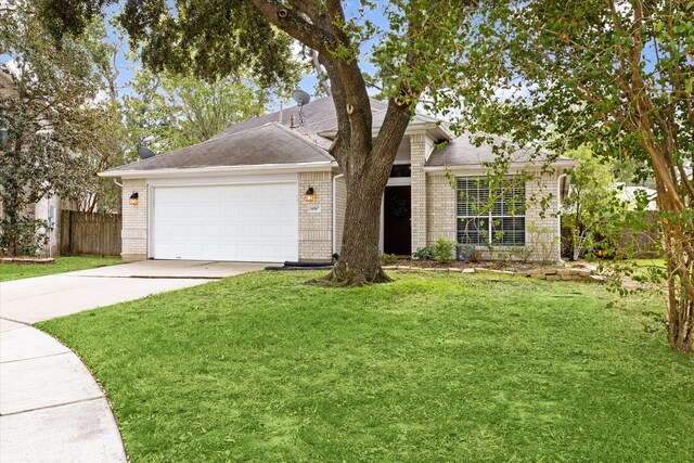 view of front of house featuring a front yard and a garage