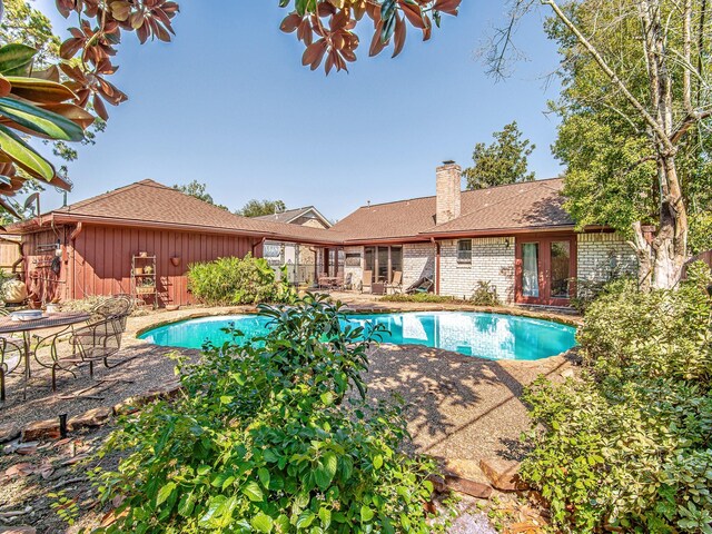 pool featuring a patio area and french doors