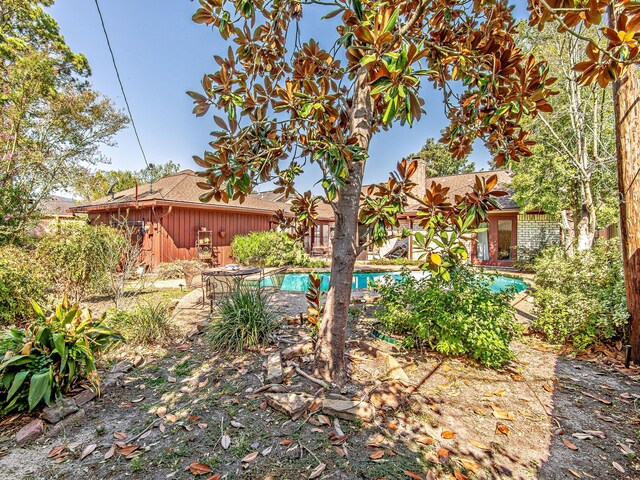 view of yard with an outdoor pool