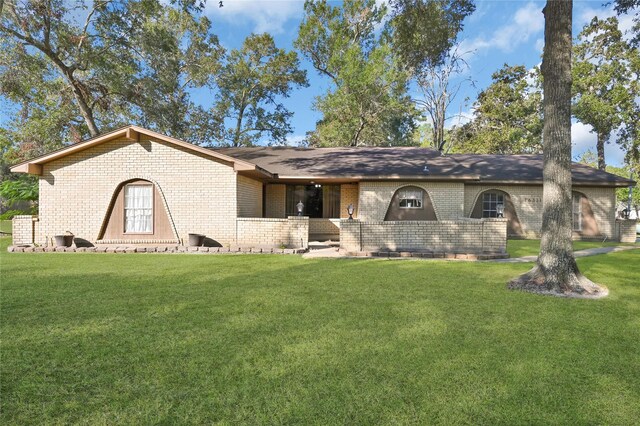 ranch-style home with a front lawn