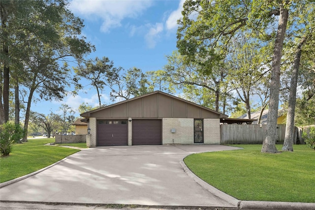 view of front of home with a garage and a front lawn