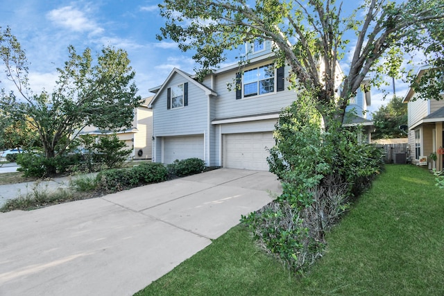 view of front facade with a garage and a front lawn