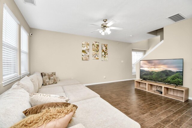 6059 Shelbourne Park Ln, Houston, TX 77084 - living area with wood finished floors, ceiling fan, and baseboards
