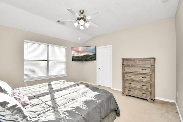 6059 Shelbourne Park Ln, Houston, TX 77084 - bedroom with light carpet, baseboards, lofted ceiling, and ceiling fan