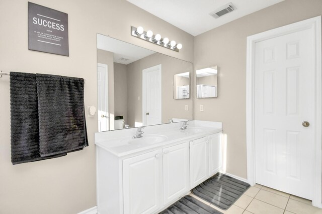 6059 Shelbourne Park Ln, Houston, TX 77084 - bathroom with double vanity, tile patterned flooring, and baseboards