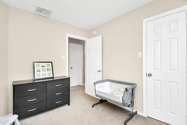 6059 Shelbourne Park Ln, Houston, TX 77084 - bedroom with light colored carpet and baseboards