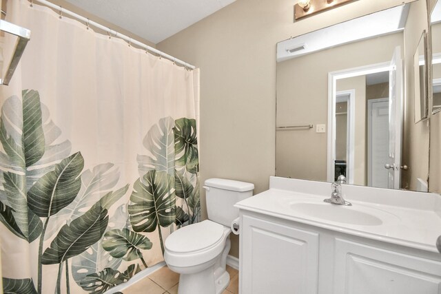 6059 Shelbourne Park Ln, Houston, TX 77084 - full bath with tile patterned floors, vanity, toilet, and curtained shower