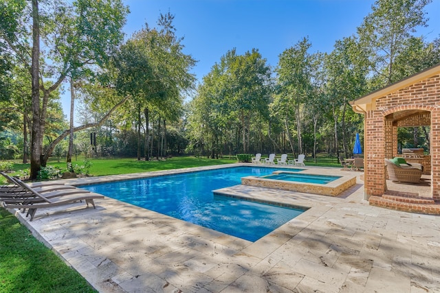 view of swimming pool with an in ground hot tub, a patio area, and a yard