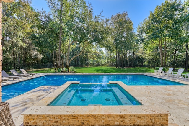 view of swimming pool with an in ground hot tub, a patio, and a lawn