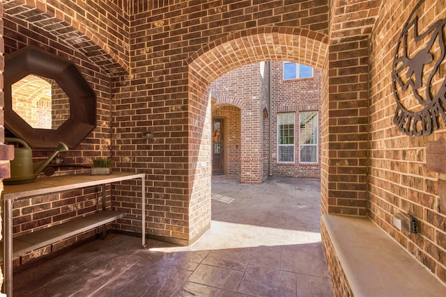 wine cellar featuring brick wall and plenty of natural light