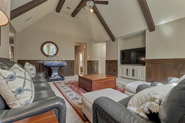 carpeted living room featuring beam ceiling, high vaulted ceiling, and ceiling fan