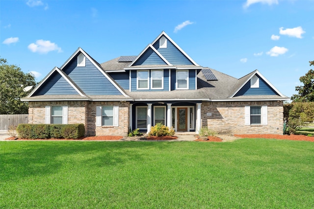 craftsman-style home featuring a front lawn