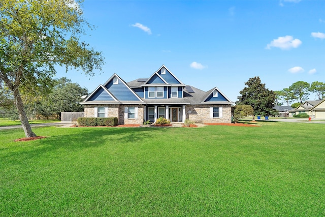 craftsman house featuring a front yard