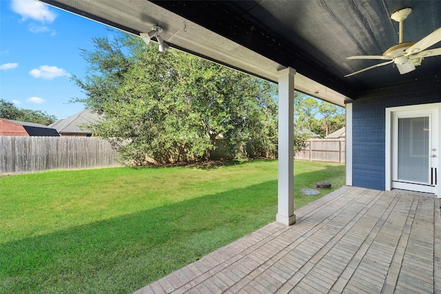 view of yard featuring ceiling fan