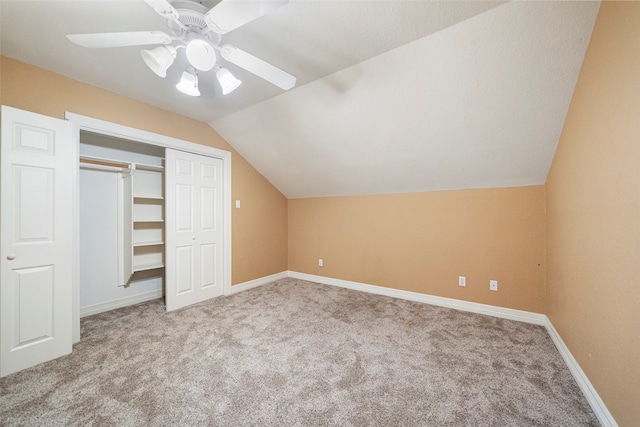 additional living space with lofted ceiling, light colored carpet, and ceiling fan