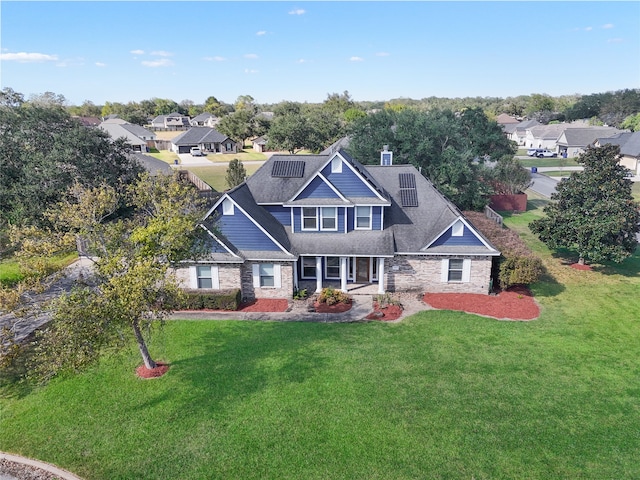 craftsman-style house featuring a front yard