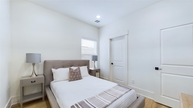 bedroom with light wood-type flooring