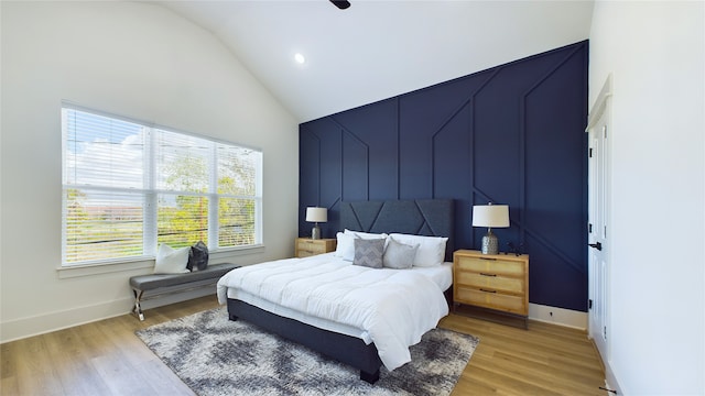 bedroom featuring vaulted ceiling, ceiling fan, and light hardwood / wood-style floors