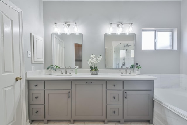 bathroom featuring vanity and separate shower and tub