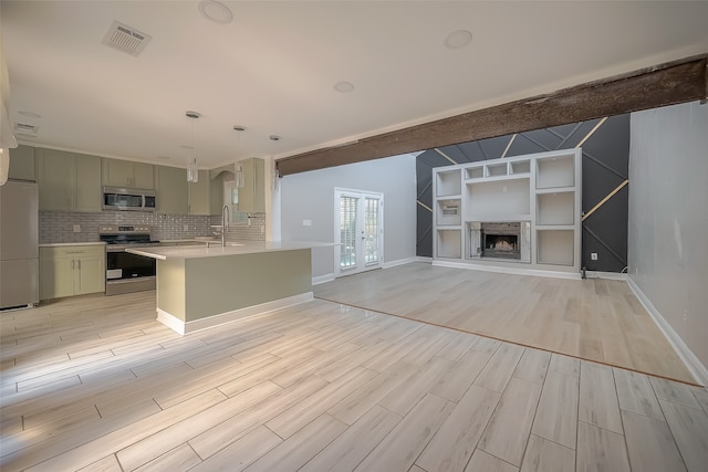 kitchen with backsplash, beamed ceiling, pendant lighting, light hardwood / wood-style floors, and stainless steel appliances