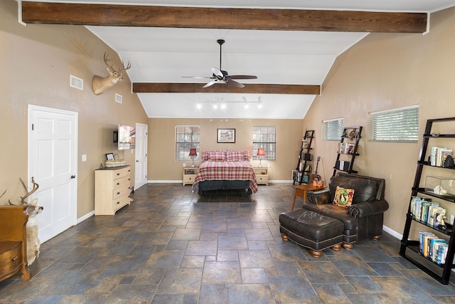 bedroom featuring ceiling fan and lofted ceiling with beams