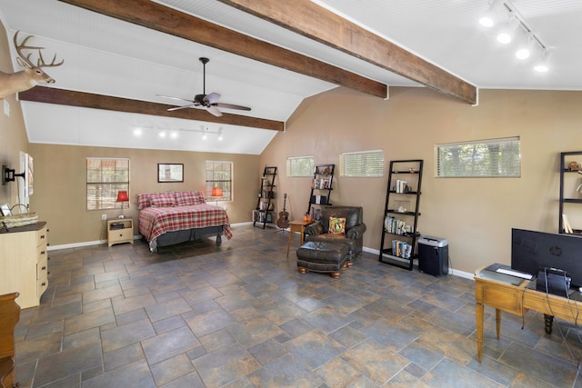 bedroom featuring ceiling fan, lofted ceiling with beams, and track lighting