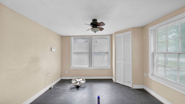 unfurnished bedroom featuring ceiling fan