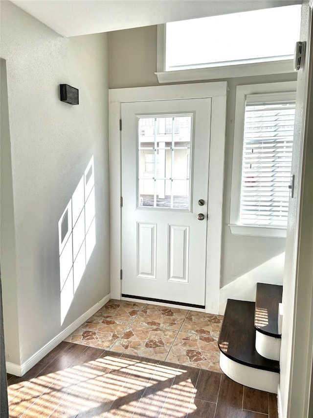 doorway to outside with light hardwood / wood-style floors