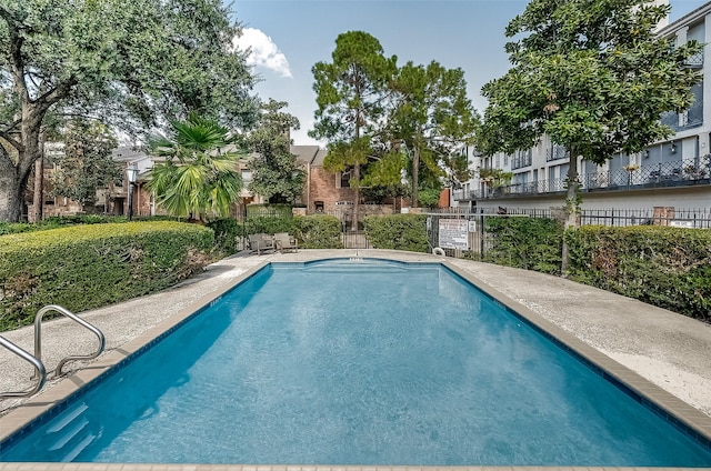 community pool with fence