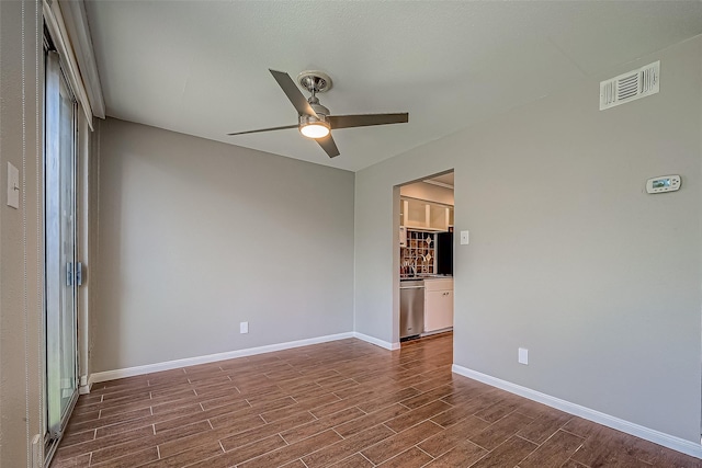 2333 Bering Dr Unit 139, Houston, TX 77057 - spare room featuring ceiling fan, dark wood-type flooring, and baseboards