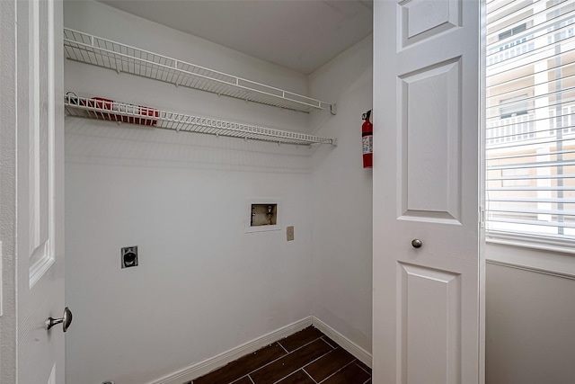2333 Bering Dr Unit 139, Houston, TX 77057 - laundry room with washer hookup, electric dryer hookup, dark wood finished floors, and baseboards