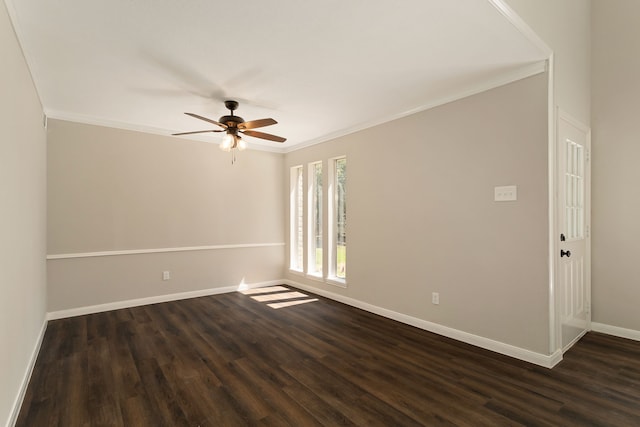 empty room with ornamental molding, dark wood-type flooring, and ceiling fan