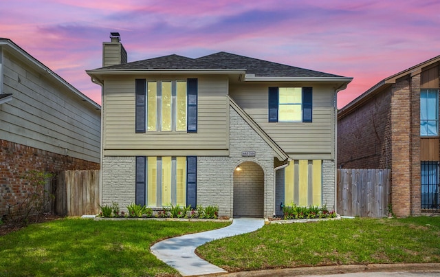 view of front of home featuring a yard