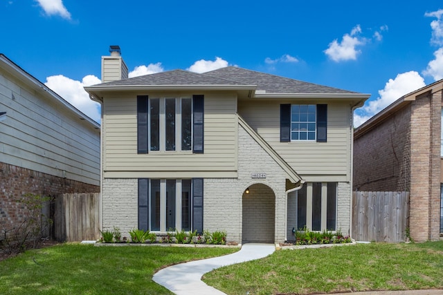 front facade with a front lawn