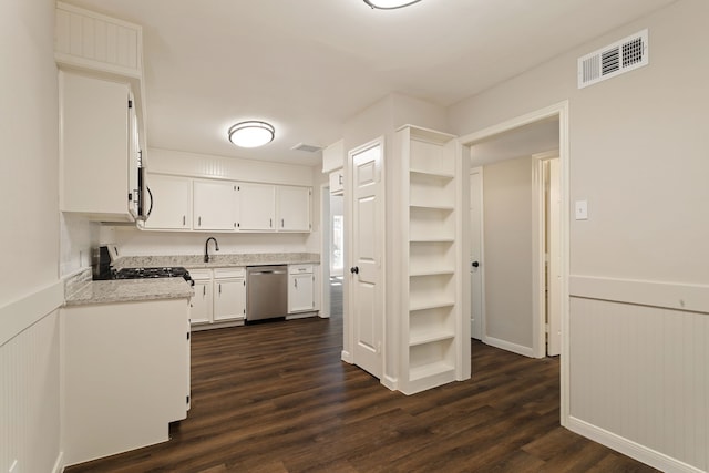 kitchen featuring dishwasher, dark wood-type flooring, sink, range, and white cabinets