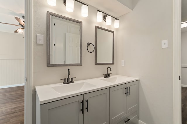 bathroom featuring vanity, wood-type flooring, and ceiling fan