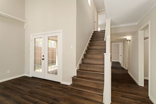 stairs with french doors, ornamental molding, and hardwood / wood-style floors