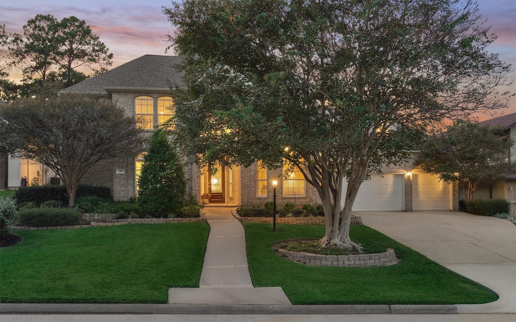 obstructed view of property featuring a lawn