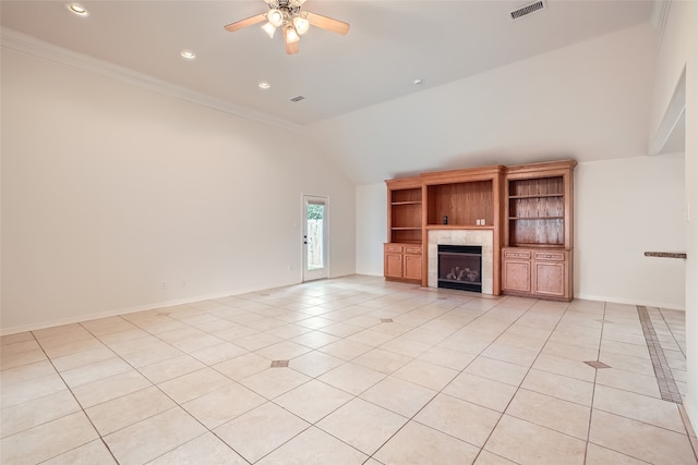 unfurnished living room with ornamental molding, a fireplace, and light tile patterned floors