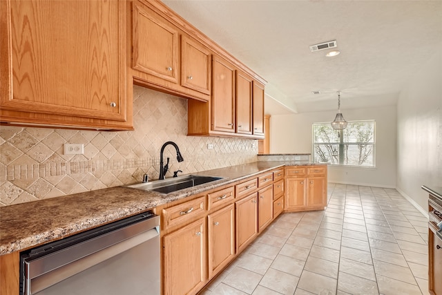 kitchen featuring sink, decorative light fixtures, stainless steel dishwasher, decorative backsplash, and light tile patterned floors