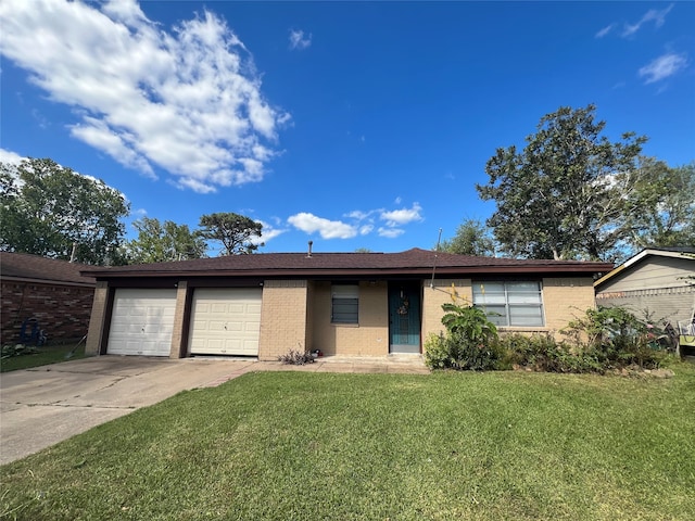 single story home featuring a front yard and a garage